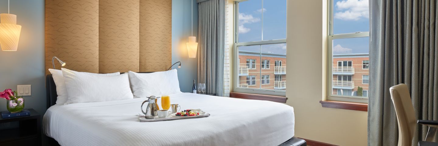 Waterview bedroom hotel suite on Boston Harbor